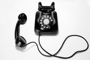 A black rotary dial phone that can be used for 24/7 phone coaching to access one of your DBT therapists