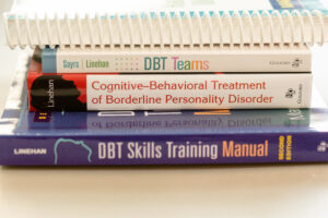 Four DBT books used by Comprehensive DBT therapists at Cincinnati Center for DBT