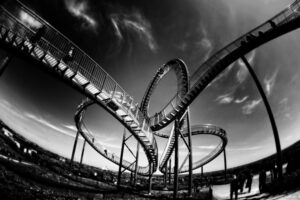 Black and white photo of twist and turn roller coaster