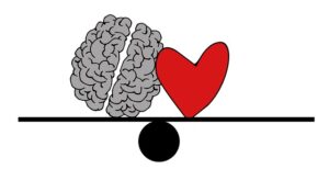 Brain and heart in the middle of a scale in balance 