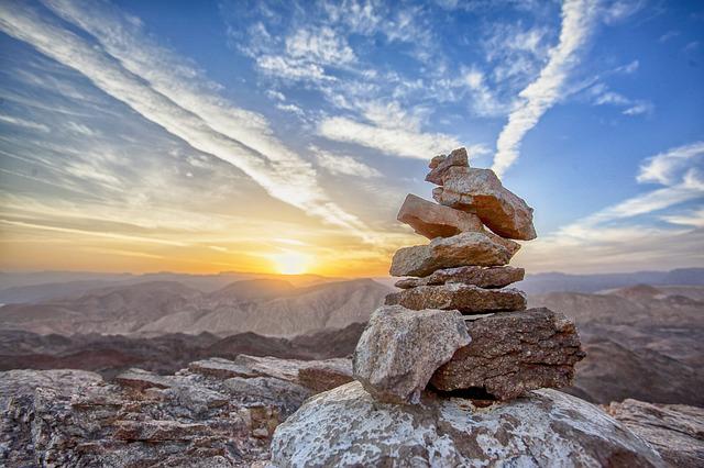 Balanced stones with the sun setting in the background