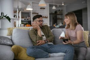 husband and wife arguing blame judgement secondary emotions 