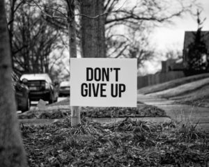 don't give up sign