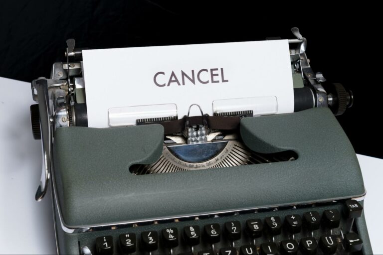 A typewriter with the word "cancel" typed out on paper