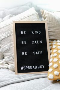 a reminder to accumulate positives board saying be kind be calm be safe #spreadjoy random acts of kindness