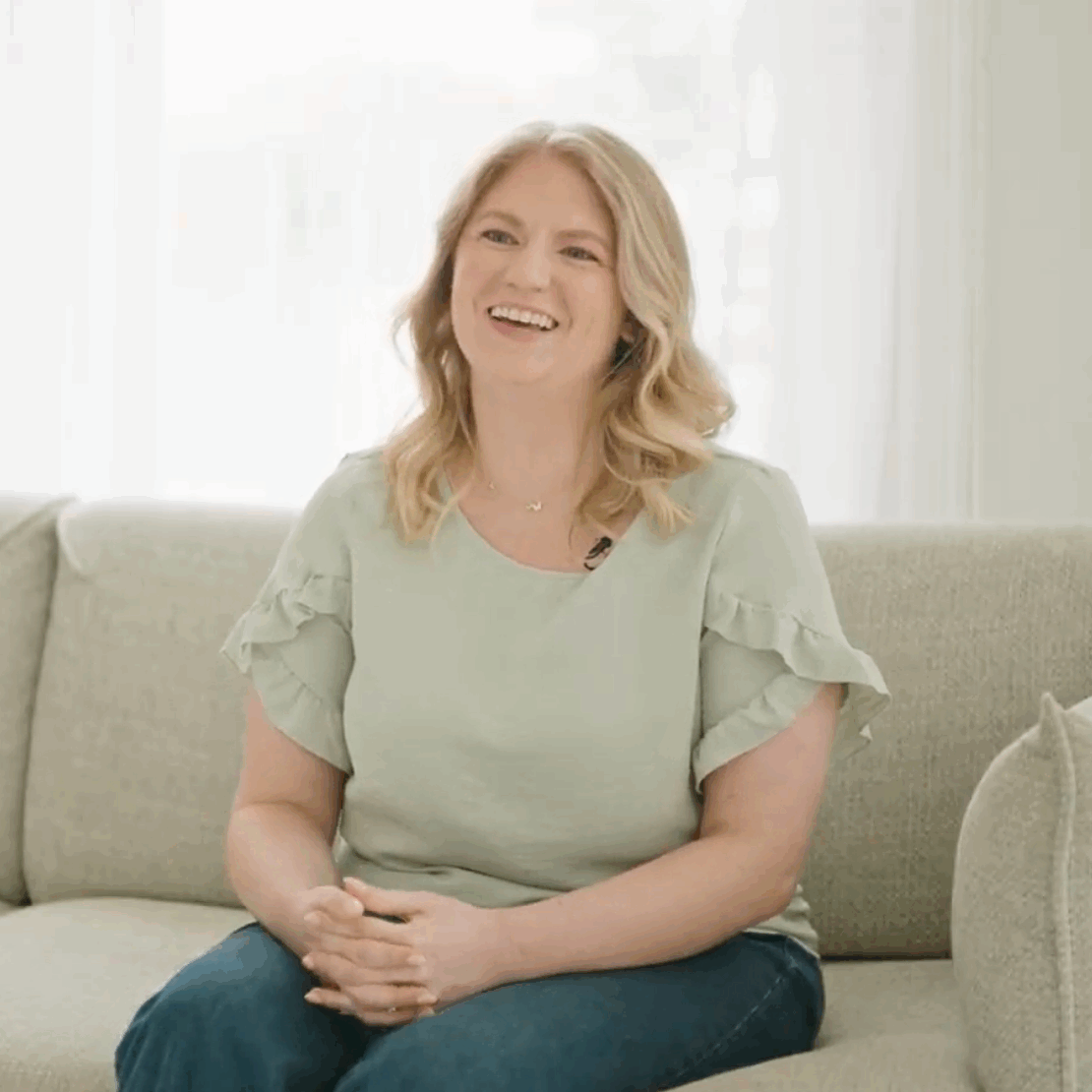 Cincinnati DBT Counselor Megan Rainey smiles at the camera in an olive blouse